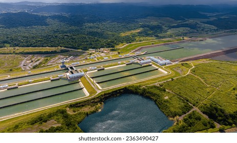 Panama Canal area view, container ship transit, water tanks, composed of locks