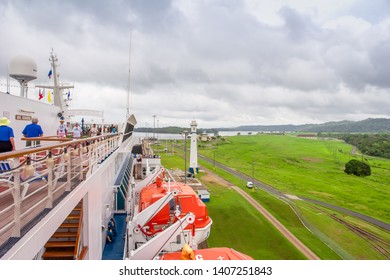 Panama Canal / Panama - May 18.2007: View On The Panama Canal From The Carnival Cruise Ship Deck With People Watching This Engineering Process. Cloudy Day.   