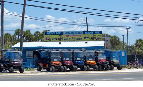 PANAMA CITY BEACH, FLORIDA, USA - MAY 13, 2020: Rental Golf Carts Near The Beach Shortly After The Beaches Reopened Following COVID-19 Closures