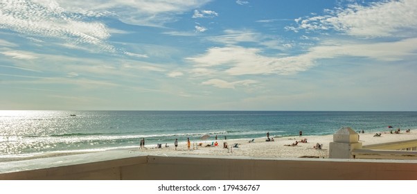 PANAMA CITY, FL - FEB. 22, 2014:  Beach goers enjoy beach and blue water of the Gulf of Mexico.  Panama City Beach is a very popular spring break destination  during the months of March and April.