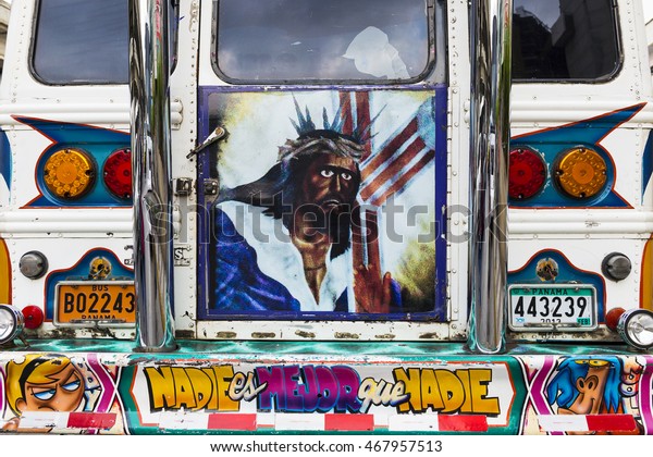 Panama\
City, Panama - March 18, 2014: Detail of the back of a Red Devil\
Bus (Diablo Rojo) in Panama City. Red Devil buses are public\
transports painted in bright colors and\
symbols.