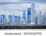 Panama City skyline with modern skyscrapers under a cloudy sky