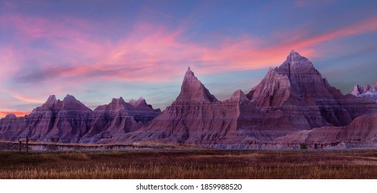Panarama of the Eroded Mountains of Badlands National Park, South Dakota During a Beautiful Pink Sunset - Powered by Shutterstock