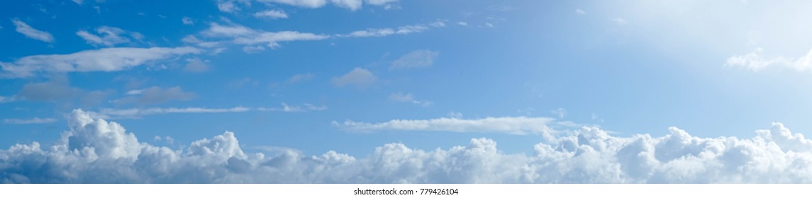 Panaramic clouds in a blue sky.