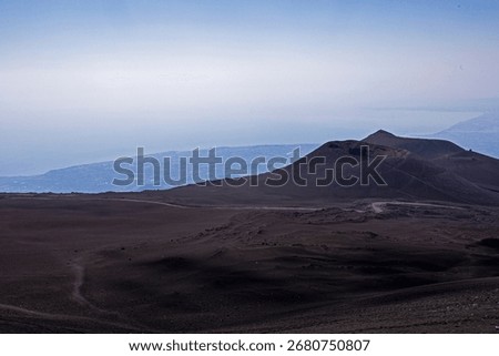 Panaramic view of the crater on Mount Etna and Sicily during the day. Traveling in Sicily