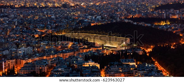 Panathinaiko stadium\
in Athens, Greece at\
night