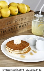 Pancake Stack With Whipped Butter And Maple Syrup