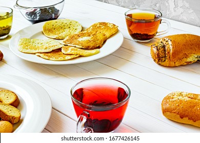 Pancakes, Crackers, Cookies, Buns, Muffin, Jam, Red, Black And Green Tea, Flat Lay - Home Baking. High Carbohydrate Breakfast