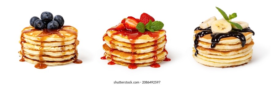 Pancakes with fruit and syrup Isolated on white background - Shutterstock ID 2086492597