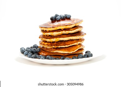 Pancakes with honey and berries on white background - Shutterstock ID 305094986