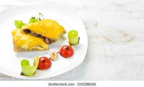 Pancakes with mushrooms and cheese. Top view. Free space for your text. - Shutterstock ID 1555288106