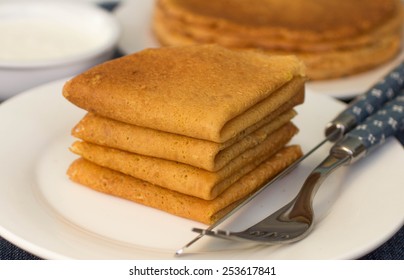 Pancakes on a white plate.  selective focus