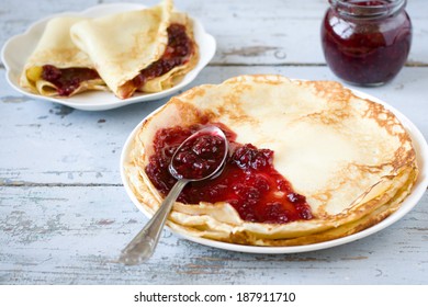 Pancakes with raspberry jam - Shutterstock ID 187911710