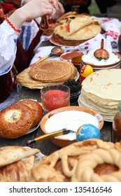 Pancakes, red and black caviar and cheesecakes on the festive table. Maslenitsa

