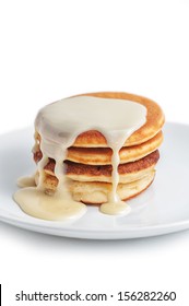 Pancakes With Sweet Condensed Milk On White Background