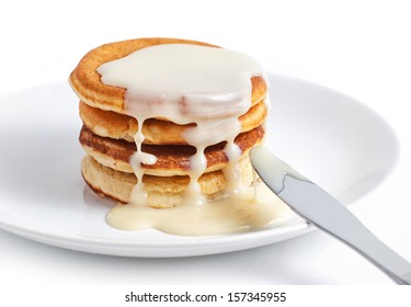 Pancakes With Sweet Condensed Milk On White Background