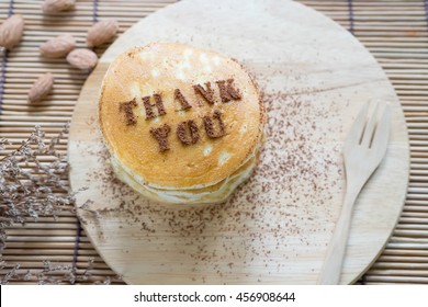 pancakes for thank you with almond and dry flower on the wood table