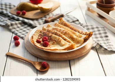 Pancakes Thin homemade pancakes with berries, traditional Russian cuisine. Homemade pancakes with berries