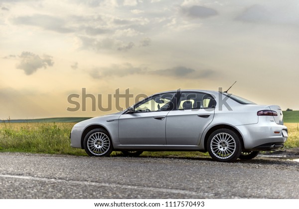 PANCEVO, SERBIA, MAY 29\
2018: Alfa romeo 159 2.4 JTDm on middle of road from low angle.\
Sport car wallpaper. 