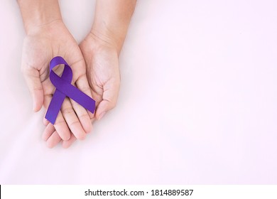 Pancreatic Cancer, world Alzheimer, epilepsy, lupus and domestic violence day Awareness month, Woman holding purple Ribbon for supporting people living. Healthcare and World cancer day concept - Shutterstock ID 1814889587