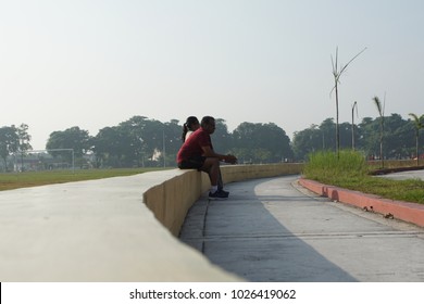 Pandamaran, Malaysia - February 16th, 2018 : Indian Couple Take A Rest After Jogging/running.