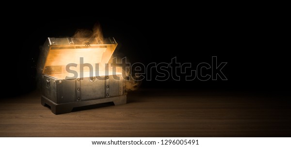 pandoras box with smoke on a wooden background