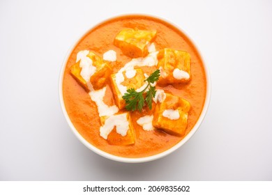 Paneer Butter Masala Or Cheese Cottage Curry Served With Rice And Laccha Paratha