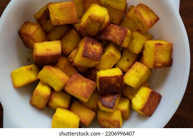 Paneer Or Indian Cottage Cheese Cubes Fried Lightly In Oil With Turmeric Powder.