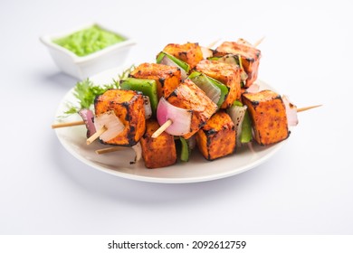 Paneer tikka is an Indian dish made from chunks of cottage cheese marinated in spices and grilled in a tandoor