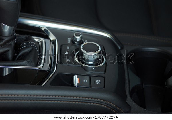 panel with\
buttons on the control panel of\
car