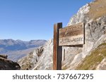 panel with direction of path  in mountain 
