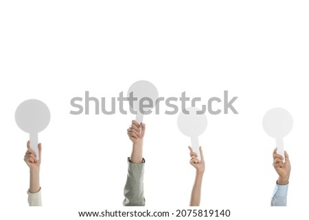 Panel of judges holding blank score signs on white background, closeup. Space for text