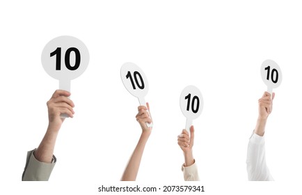 Panel of judges holding signs with highest score on white background, closeup - Shutterstock ID 2073579341