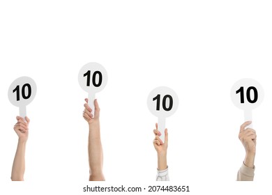 Panel of judges holding signs with highest score on white background, closeup - Powered by Shutterstock