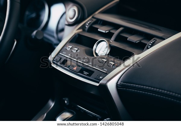 Panel of a\
modern car. Screen multimedia system.\
