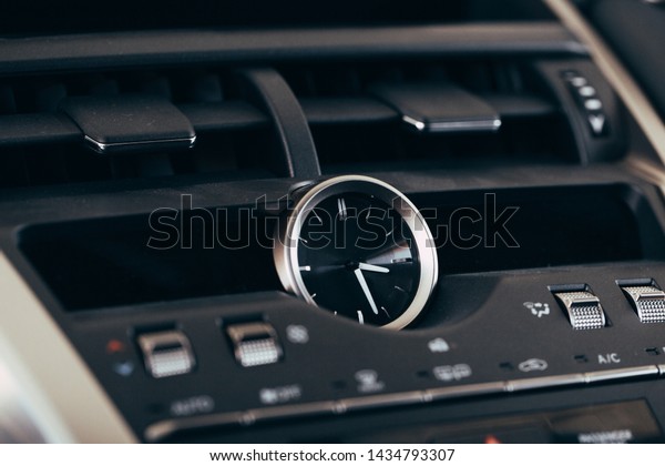 Panel of a\
modern car. Screen multimedia system.\
