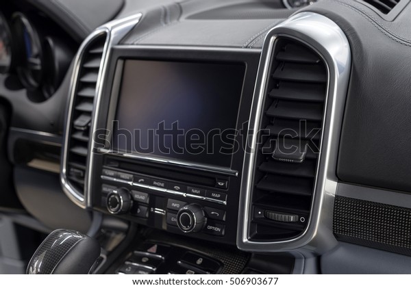 Panel of \
modern car. Screen multimedia\
system.