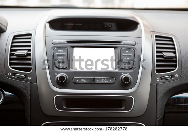 Panel of a modern car with a white screen\
multimedia system