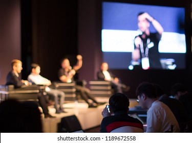 Panel On Stage During Discussion Event. Debate With Experts During Conference Seminar Presentation. Successful Executives And Entrepreneur Speakers And Presenters In Conference Hall Lecture Series.