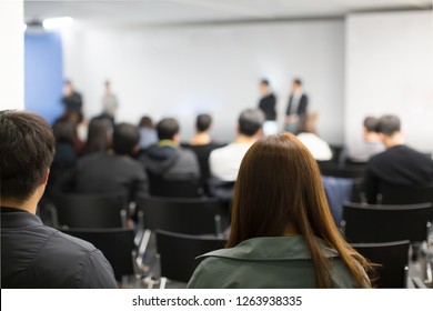 Panel On Stage During Discussion Event. Debate With Experts During Conference Seminar Presentation. Successful Executives And Entrepreneur Speakers And Presenters In Conference Hall Lecture Series.