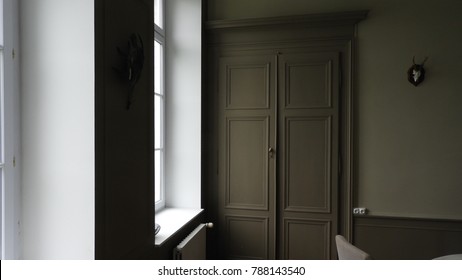 Panelled Room: French Interior With Panelled Door Illuminated By Side Light From A Window