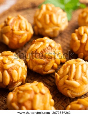 Panellets with pine nuts and almonds. A typical Catalan dessert made with marzipan and nuts.