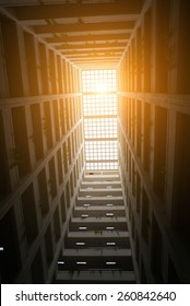 Panels from the ceiling and the shadows inside the building.