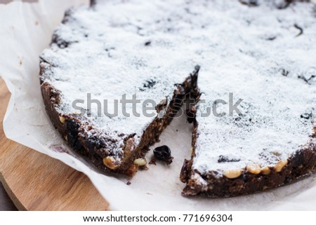 Panforte traditional italian delicious cake. Various nuts and candiet. Selective focus 