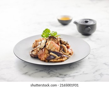 Pan-fried Grouper Fish Belly With Mushroom Sauce Served In A Dish Side View On Grey Background