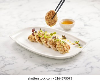 Pan-fried Minced Pork With Silver Fish And Chopsticks Served In A Dish Side View On Grey Marble Background