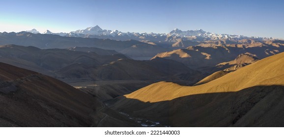 PANG LA PASS, TIBET, CHINA: general view of Mount Everest, sunny, dry and cold mineral landscape and winding gravel road - Powered by Shutterstock