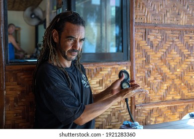 Panglao, Philippines - February 7, 2021: Scuba Diving Instructor Is Explaining How Pressure Gauge Works