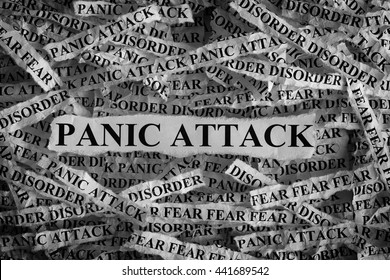 Panic Attack. Torn pieces of paper with the word Panic Attack. Concept Image. Black and White. Closeup.