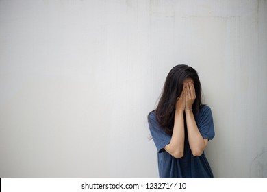 panic attacks young girl sad and fear stressful depressed emotional.crying use hands cover face begging help.stop abusing violence in women,person with health 
anxiety,people bad feeling down concept
